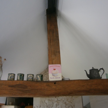 Pewter teapot and a reminder of Blighty balanced on the beams!